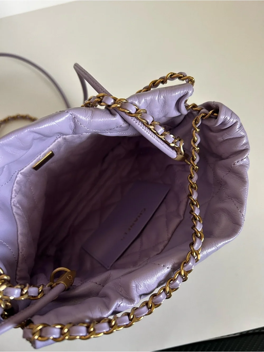 CHANEL Mini 22 Lavender Quilted Leather Crossbody with Gold Logo Medallion